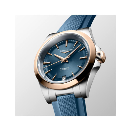 Reloj Longines Conquest 34MM L3.430.5.92.9. Género: Mujer. Material: Acero/Oro. Tamaño: De 32mm a 38mm. Correa: Caucho. Color esfera: Azul. Estilo: Deportivo. Movimiento: Automático. Características técnicas: Calendario,Hora y segundero,Reserva de marcha
