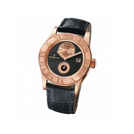 Reloj Corum Romulus 283510550001BN. Género: Hombre. Material: Oro. Tamaño: De 39mm a 42mm. Correa: Piel. Color esfera: Negro. Estilo: Clásico. Movimiento: Automático. Características técnicas: Doble uso horario,Solo hora,Calendario